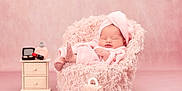 Esme joined the competition — help win amazing prizes! baby, pink, towel, head_wrap, fluffy_chair, nightstand, makeup, lipstick, powder, handbag, sleeping, soft_texture, cute, infant, portrait, studio, cozy, pastel, furniture, child