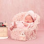 baby, pink, towel, head_wrap, fluffy_chair, nightstand, makeup, lipstick, powder, handbag, sleeping, soft_texture, cute, infant, portrait, studio, cozy, pastel, furniture, child