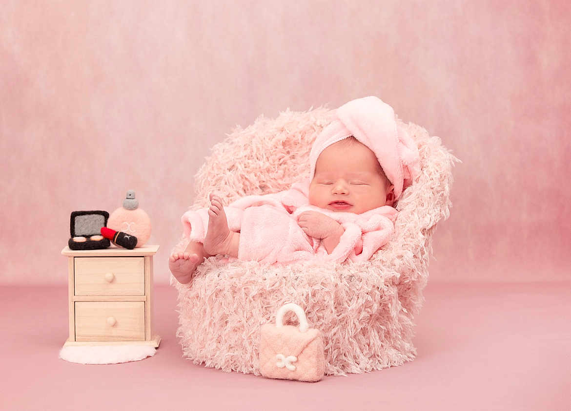 Esme joined the competition — help win amazing prizes! baby, pink, towel, head_wrap, fluffy_chair, nightstand, makeup, lipstick, powder, handbag, sleeping, soft_texture, cute, infant, portrait, studio, cozy, pastel, furniture, child