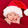 Esme is registered to the contest to win money with this photo: baby, infant, santa_hat, red_blanket, cute, christmas, holiday, face, expression, puckered_lips, soft_texture, cozy, portrait, newborn, hand, wrapped, festive, fluffy, child, celebration