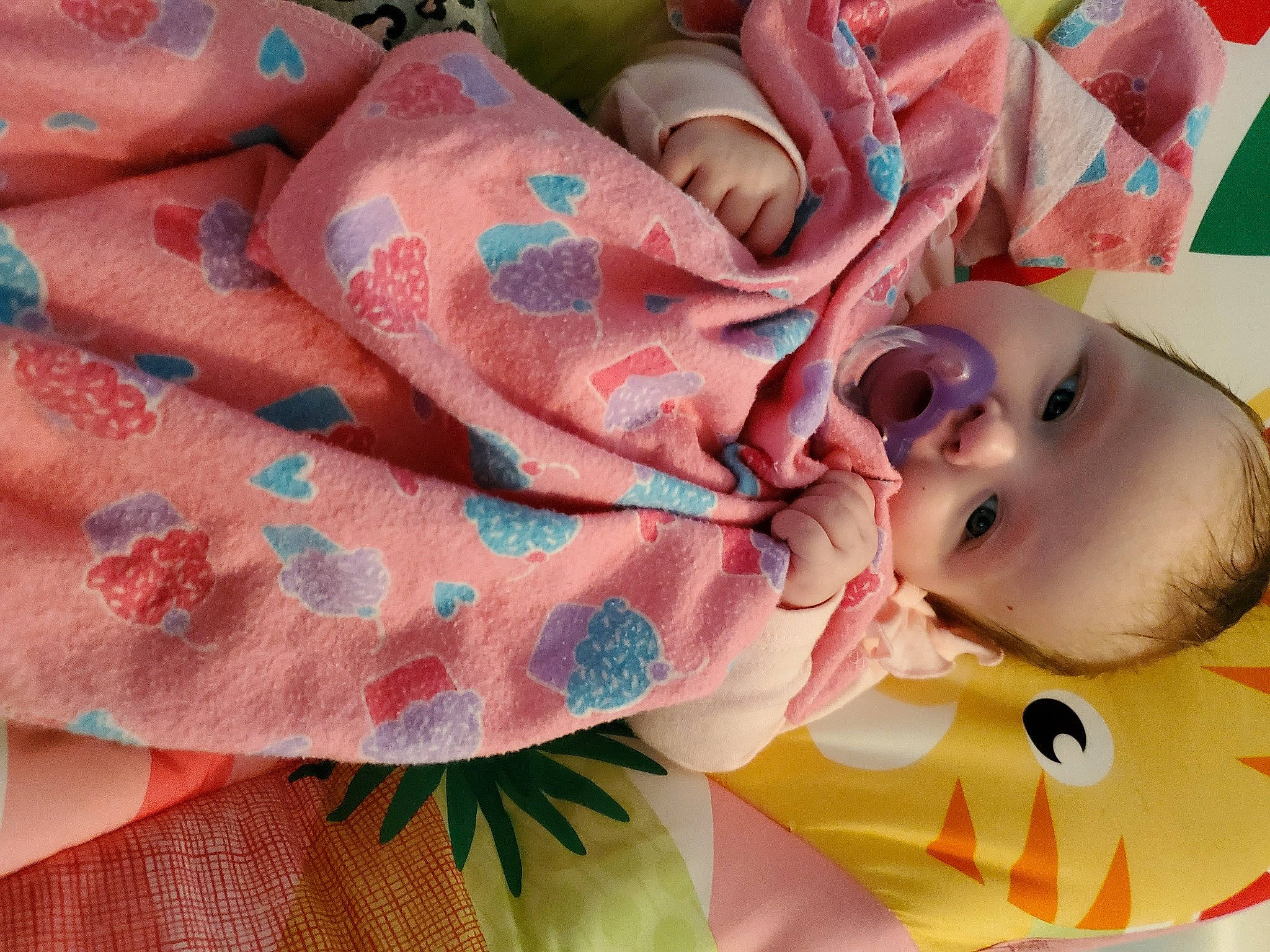 Megan participe au concours pour gagner de l'argent avec cette photo : art, baby, baby_products, baby_toddler_clothing, carmine, cheek, child, close_up, fashion_accessory, grass, happy, linens, lip, pattern, peach, person, pink, skin, textile, toddler