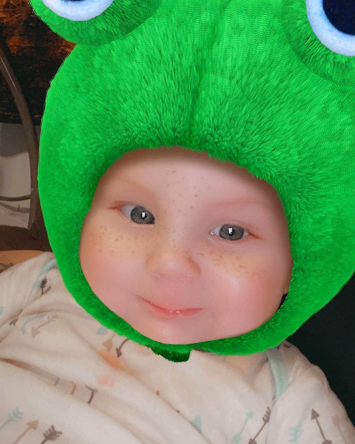 Westley joined the competition — help win amazing prizes! baby, baby_toddler_clothing, cap, costume_hat, event, fashion_accessory, fur, fur_clothing, green, happy, hat, head, headgear, headwear, knit_cap, person, sleeve, smile, textile, toddler