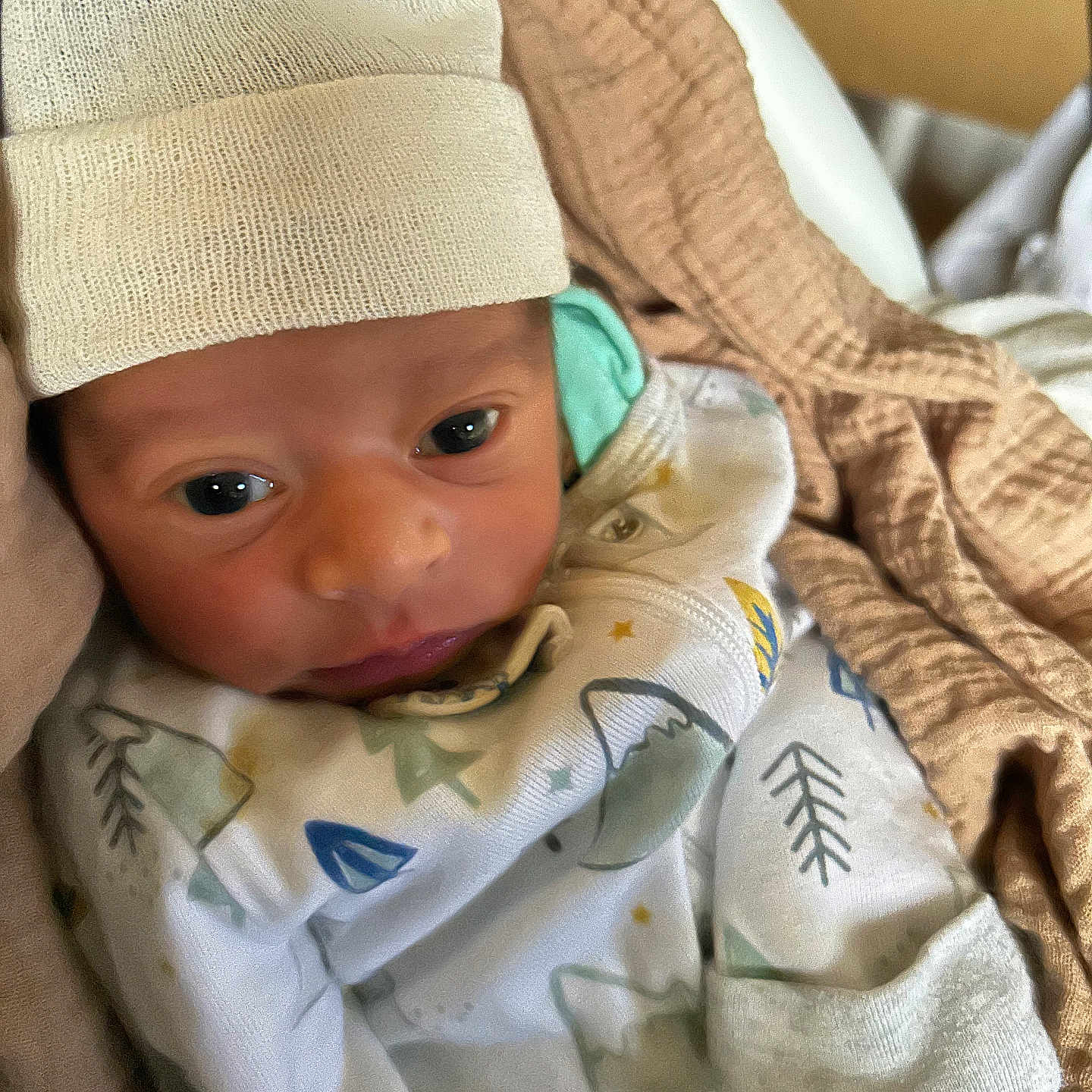 Christoforos joined the competition — help win amazing prizes! baby, blanket, child, clothing, cozy, cute, face, hat, headwear, indoors, infant, newborn, newborn_baby, person, portrait, sleepwear, soft, warm, wrapped, young