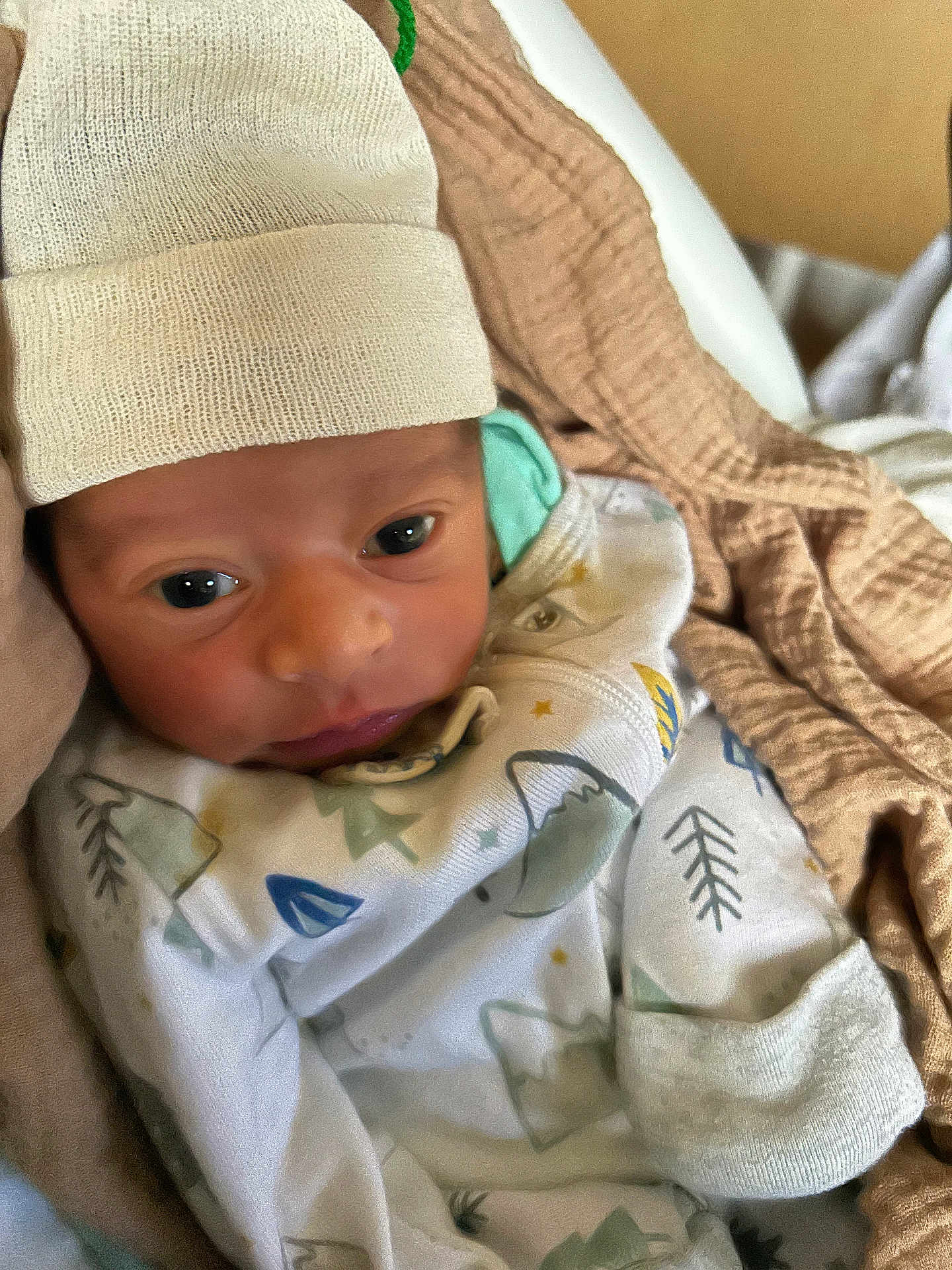 Christoforos joined the competition — help win amazing prizes! baby, newborn, infant, hat, blanket, clothing, face, person, wrapped, cute, soft, warm, indoors, cozy, sleepwear, young, headwear, portrait, child, newborn_baby