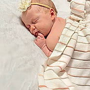 Nelly joined the competition — help win amazing prizes! baby, sleeping, blanket, headband, flower, soft, cozy, infant, peaceful, skin, hand, portrait, child, cute, rest, comfort, warmth, striped, plush, nap