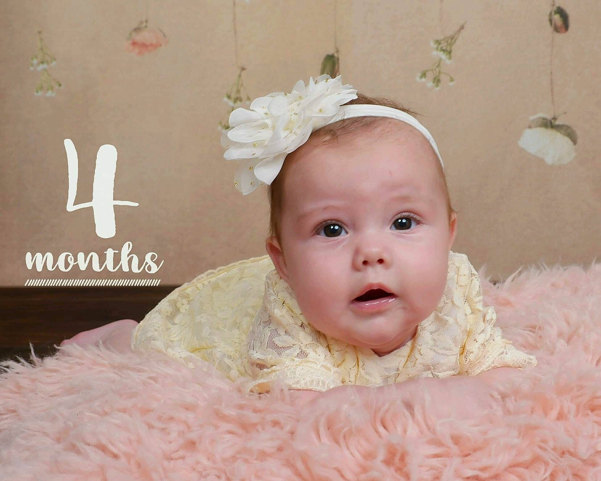 Kaylee is registered to the contest to win money with this photo: baby, baby_toddler_clothing, child, dress, fashion_accessory, fur, hair_accessory, happy, head, headband, headgear, headpiece, person, photograph, photography, pink, product, skin, smile, textile