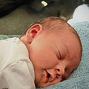 Priya a rejoint le concours — aidez-le/la à gagner de superbes lots ! baby, sleeping, newborn, blanket, face, closeup, peaceful, infant, soft, cozy, rest, cute, skin, mouth, clothing, head, young, toddler, portrait, relaxation