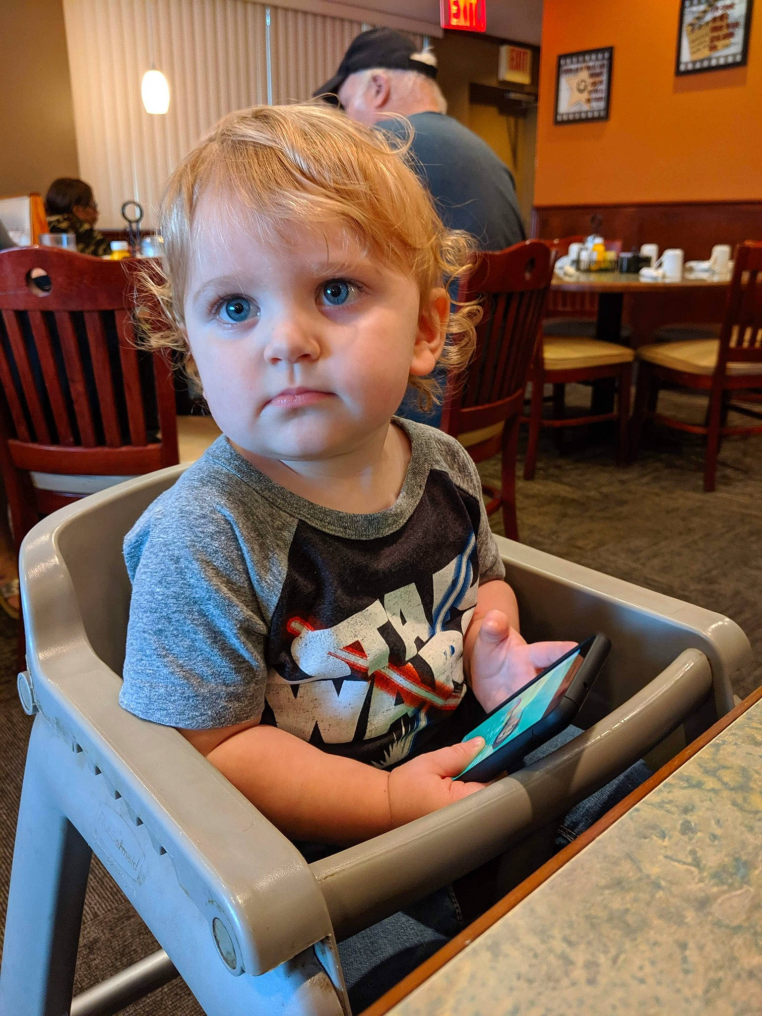 Braydon joined the competition — help win amazing prizes! baby, chair, child, furniture, leisure, person, reading, room, sitting, table, toddler, vacation