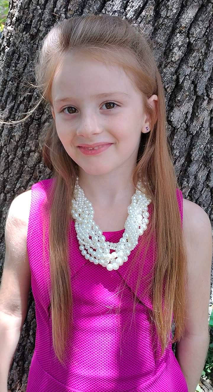 Kaylie is registered to the contest to win money with this photo: blond, eye, grass, hair, happy, head, human_body, iris, jewellery, joy, lip, long_hair, magenta, neck, necklace, organ, pattern, person, pink, purple