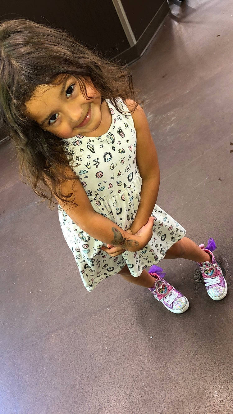 Tessa is registered to the contest to win money with this photo: black_hair, child, child_model, footwear, joy, leg, long_hair, nose, person, photography, shoe, sitting, smile, thigh, toddler