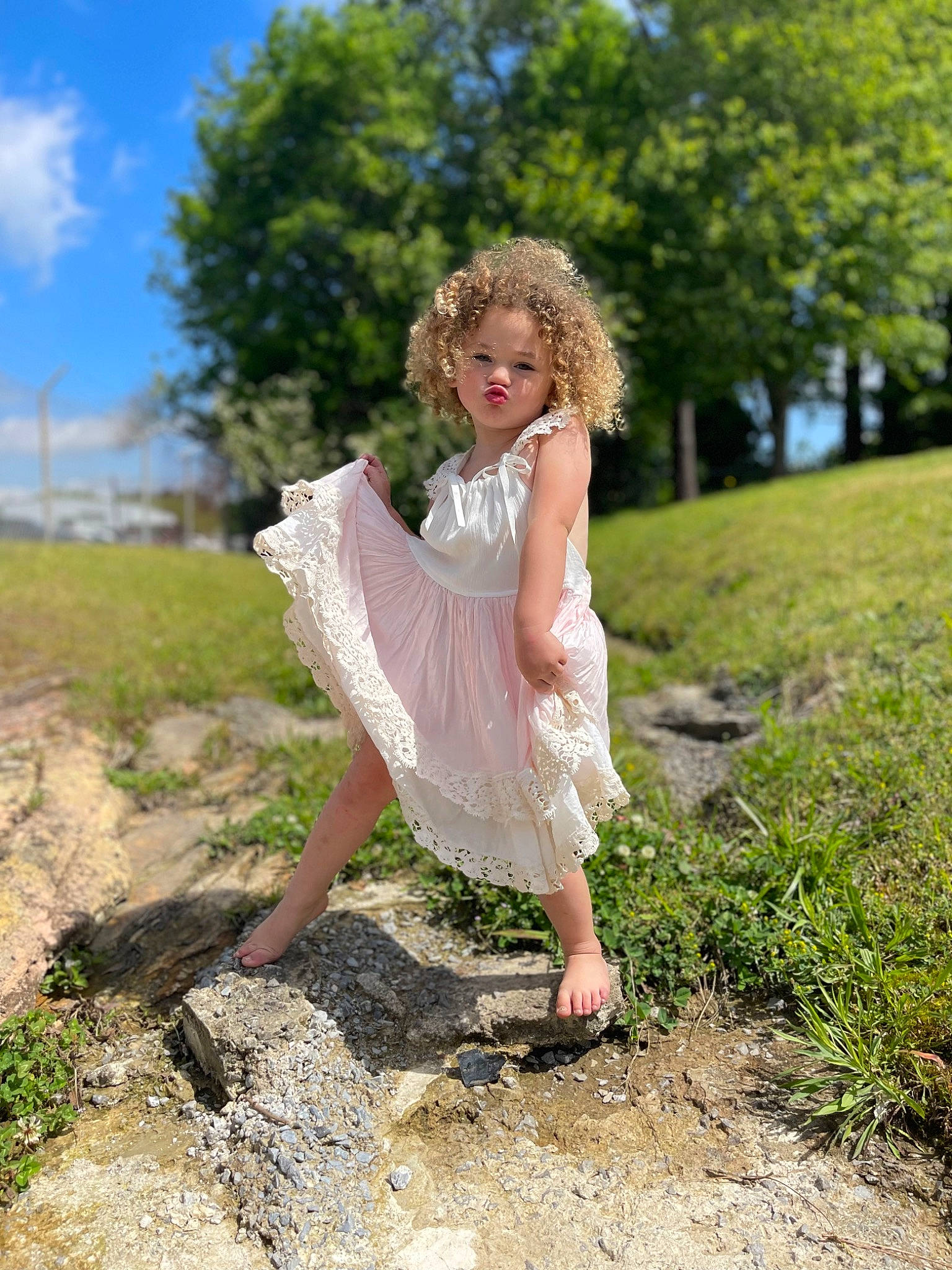 Azaria is registered to the contest to win money with this photo: botany, day_dress, dress, fawn, forest, fun, grass, grassland, happy, human_leg, landscape, leisure, long_hair, meadow, people_in_nature, person, plant, sandal, sky, tree