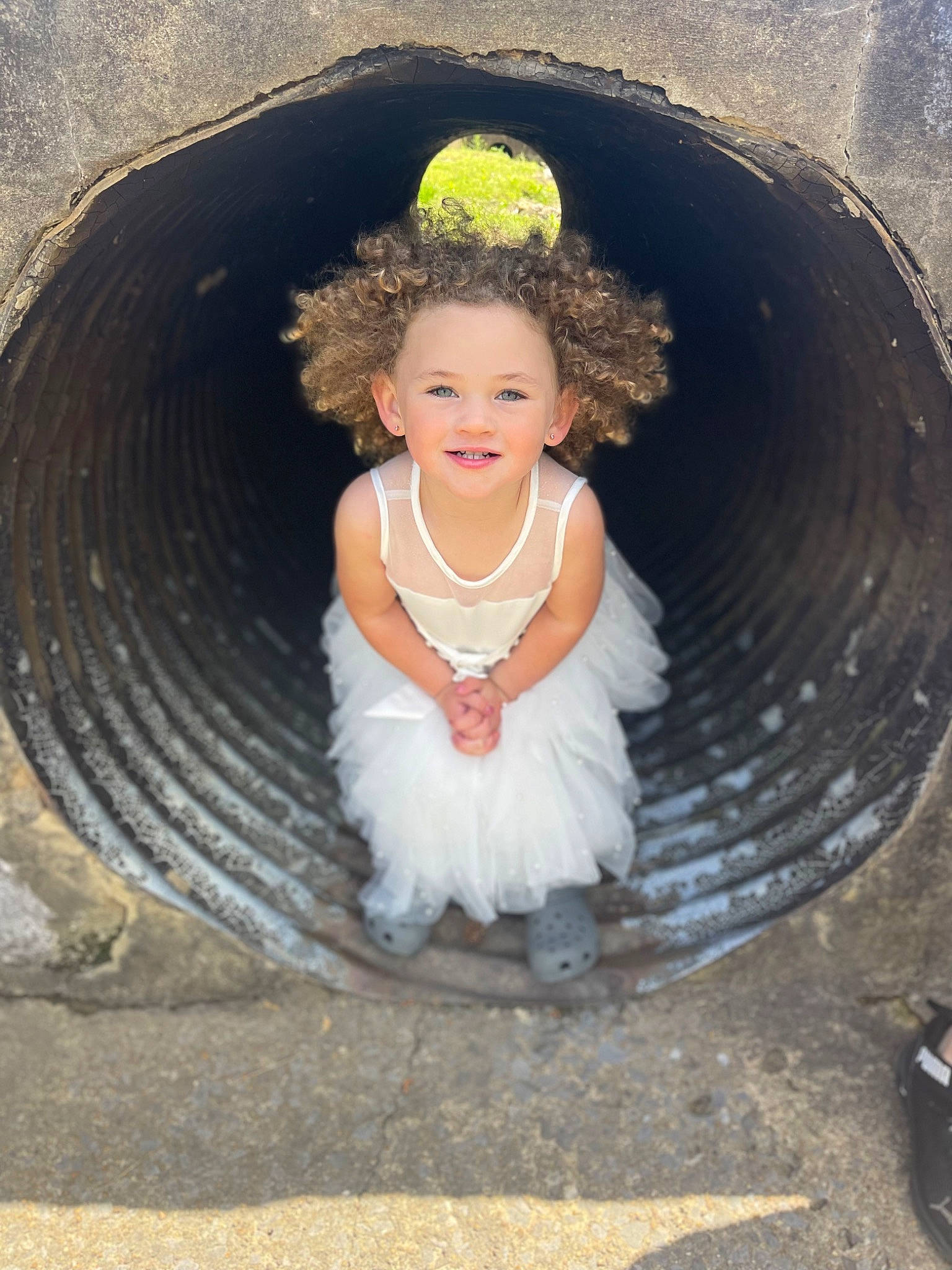 Azaria joined the competition — help win amazing prizes! automotive_tire, baby_toddler_clothing, child, chin, circle, dress, eye, flash_photography, fun, grass, hair, hairstyle, happy, head, joy, leisure, person, sitting, smile, soil