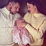 affection, baby, caring, child, closeup, couple, family, holding_baby, indoor, knitwear, lace, love, parenting, people, pink_dress, portrait, sweater, tenderness, warm_lighting, young_adult
