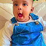 Charlene joined the competition — help win amazing prizes! baby, child, denim_overalls, white_shirt, hair_ties, colorful_hair, indoor, couch, pillow, expression, cute, infant, skin, hand, sitting, portrait, clothing, face, happy, person