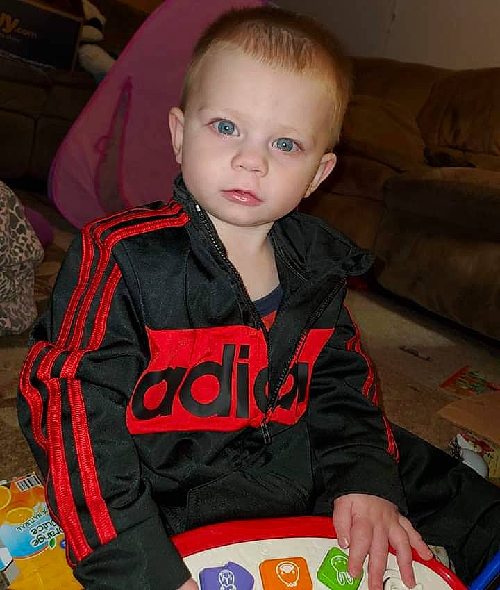 Colten joined the competition — help win amazing prizes! baby, baby_toddler_clothing, carmine, chair, child, comfort, couch, fun, hoodie, human_body, lap, person, personal_protective_equipment, reading, room, sitting, sleeve, t_shirt, toddler