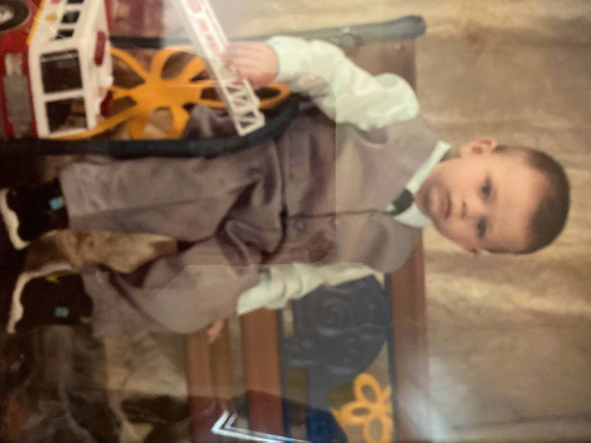 Colten is registered to the contest to win money with this photo: baby, baseball_glove, child, costume, face_mask, fun, helmet, person, personal_protective_equipment, room, sports_gear, toddler, uniform