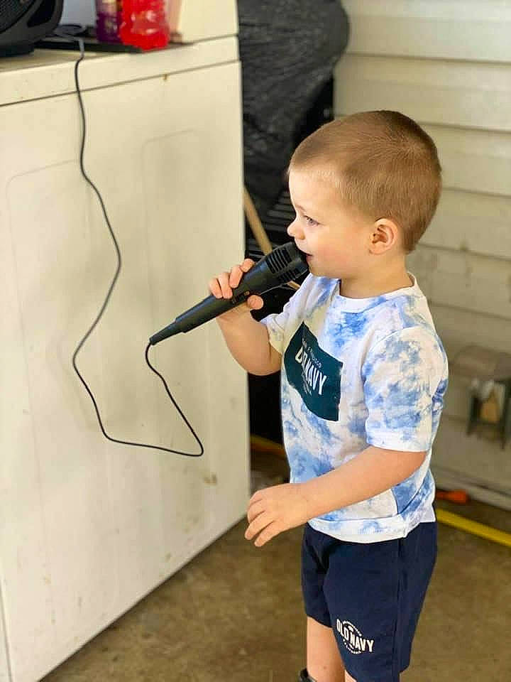 Colten is registered to the contest to win money with this photo: active_shorts, arm, bermuda_shorts, child, elbow, electric_blue, electrical_wiring, flooring, human_leg, joint, person, play, recreation, shorts, shoulder, sleeve, sportswear, standing, t_shirt, toddler