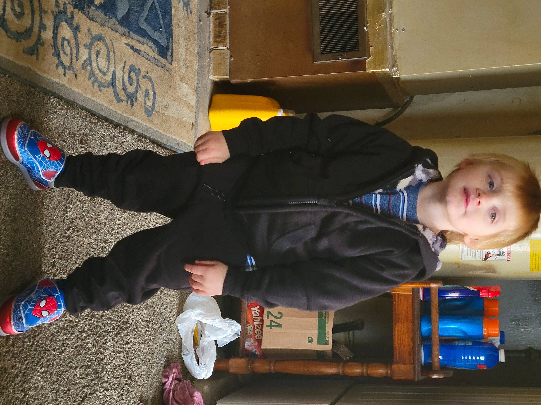 James is registered to the contest to win money with this photo: child, electric_blue, fun, human_leg, jacket, person, shoe, sitting, smile, sneakers, street_fashion, suit, toddler, walking_shoe