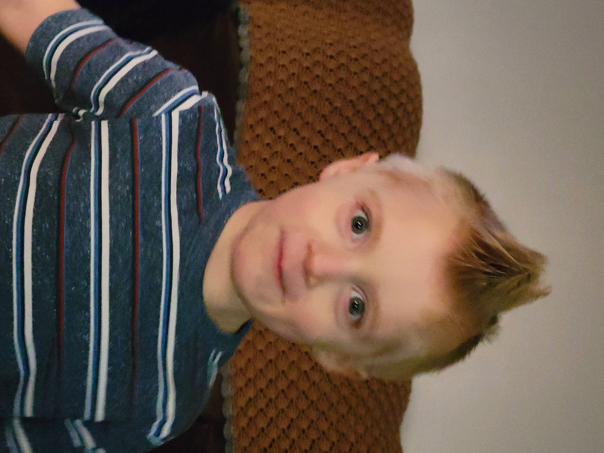 Clayton is registered to the contest to win money with this photo: baby_toddler_clothing, cheek, child, comfort, dress_shirt, fun, happy, iris, nose, pattern, person, plaid, portrait_photography, room, sitting, sleeve, smile, toddler, wood