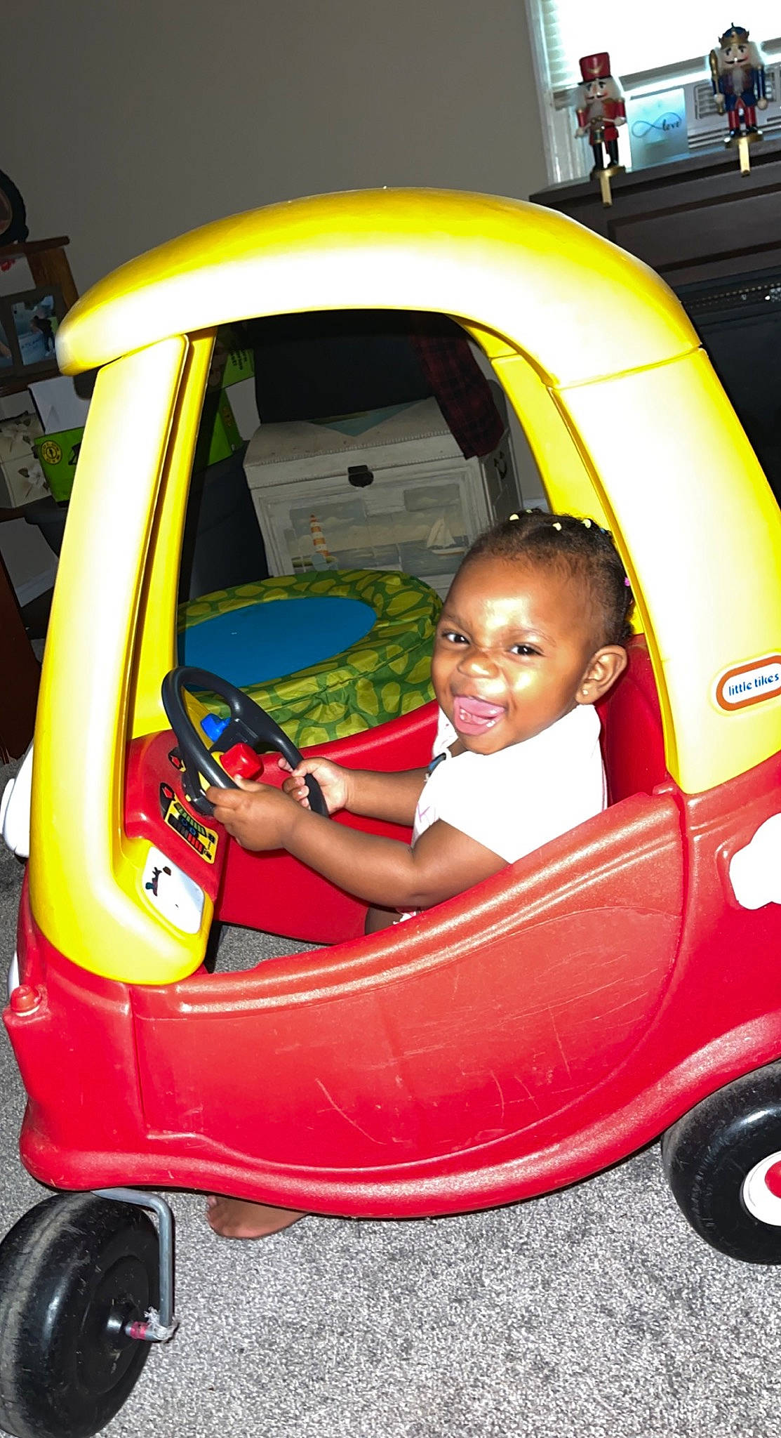 Janila is registered to the contest to win money with this photo: auto_part, automotive_design, automotive_exterior, baby_toddler_clothing, bumper, car, car_seat, child, family_car, fender, fun, joy, motor_vehicle, person, riding_toy, smile, tire, toddler, vehicle, vehicle_door