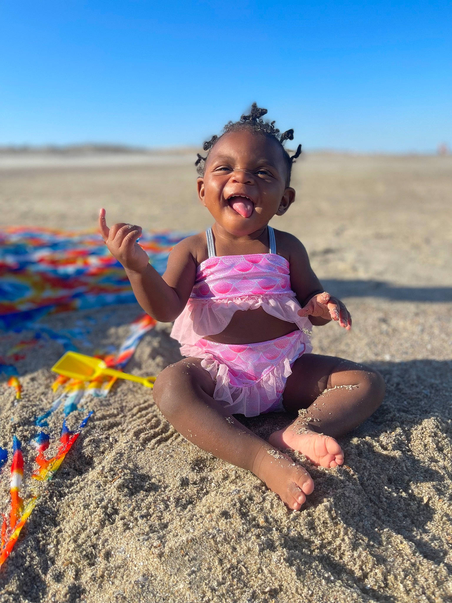 Janila is registered to the contest to win money with this photo: beach, beauty, child, fun, grass, happy, hat, landscape, leisure, morning, people_in_nature, people_on_beach, person, sand, shore, sky, smile, summer, sunlight, toddler
