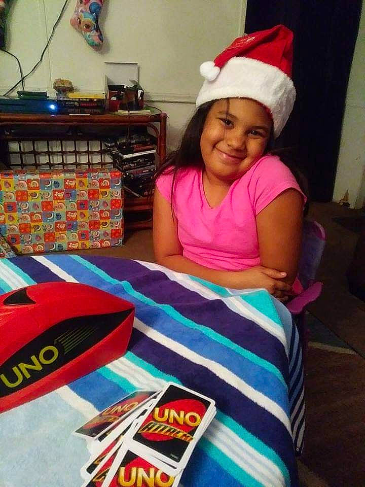 Makalah is registered to the contest to win money with this photo: child, christmas, christmas_eve, electronic_device, fun, headgear, headwear, holiday, joy, linens, person, play, smile, textile, toddler