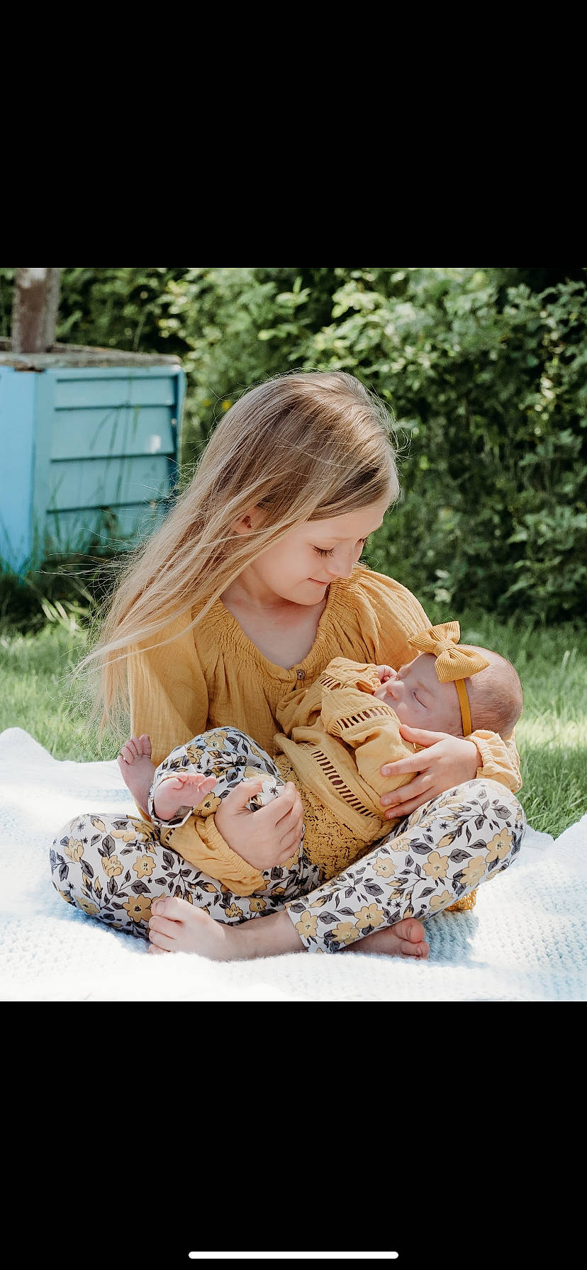 Saige joined the competition — help win amazing prizes! baby, baby_toddler_clothing, brown_hair, child, comfort, fawn, fur, grass, happy, leisure, pattern, peach, people_in_nature, person, photo_shoot, plant, play, playing_with_kids, portrait_photography, sitting
