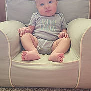 Austyn is registered to the contest to win money with this photo: armchair, baby, blue_eyes, carpet, child, chubby_cheeks, clothing, comfortable, cozy, cute, furniture, home, indoor, infant, onesie, person, portrait, sitting, soft_lighting, wood_paneling