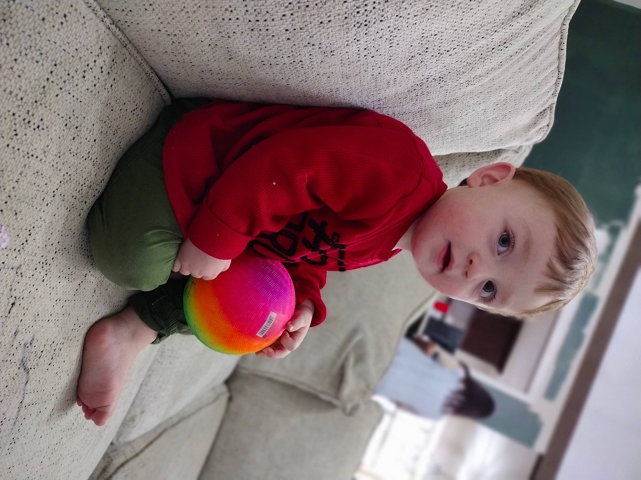 Declyn is registered to the contest to win money with this photo: baby, baby_products, baby_toddler_clothing, carmine, child, comfort, fun, happy, human_leg, knee, leisure, magenta, person, petal, play, room, smile, textile, toddler, toy