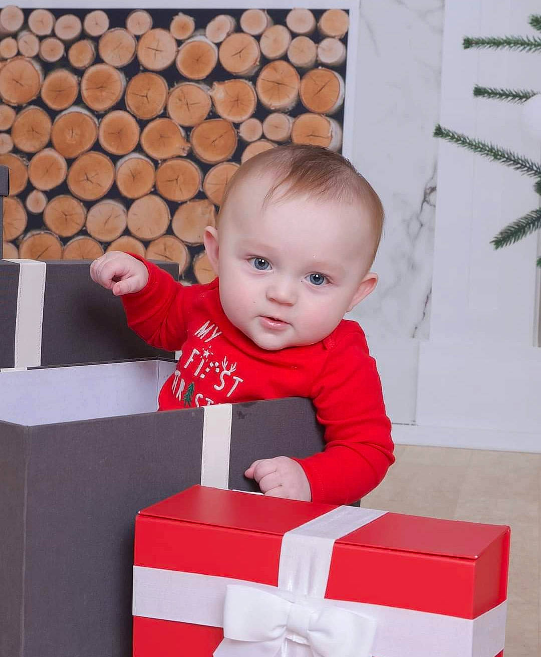 Declyn joined the competition — help win amazing prizes! baby, baby_toddler_clothing, carmine, child, flooring, fun, happy, pattern, person, rectangle, room, sitting, sleeve, smile, t_shirt, toddler, wood