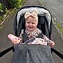 Miley joined the competition — help win amazing prizes! baby, blanket, bow, car, child, clothing, cute, greenery, happy, headband, infant, outdoor, person, phone_case, road, sidewalk, smile, stroller, toy, urban