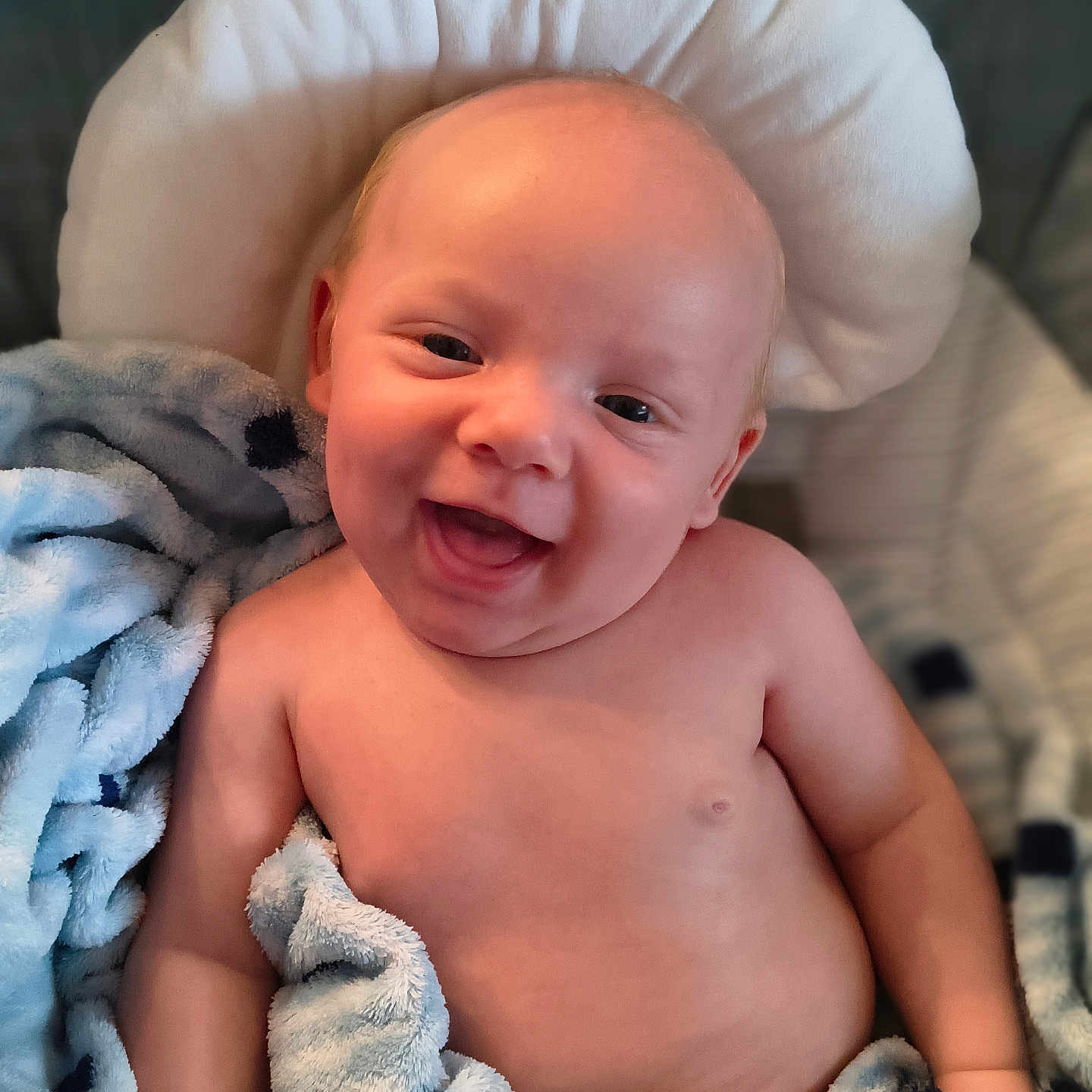 Braxtyn joined the competition — help win amazing prizes! baby, blanket, blue, child, cozy, cushion, cute, expression, face, happy, indoors, infant, person, plush, skin, smiling, soft, toddler, warm, wrapped