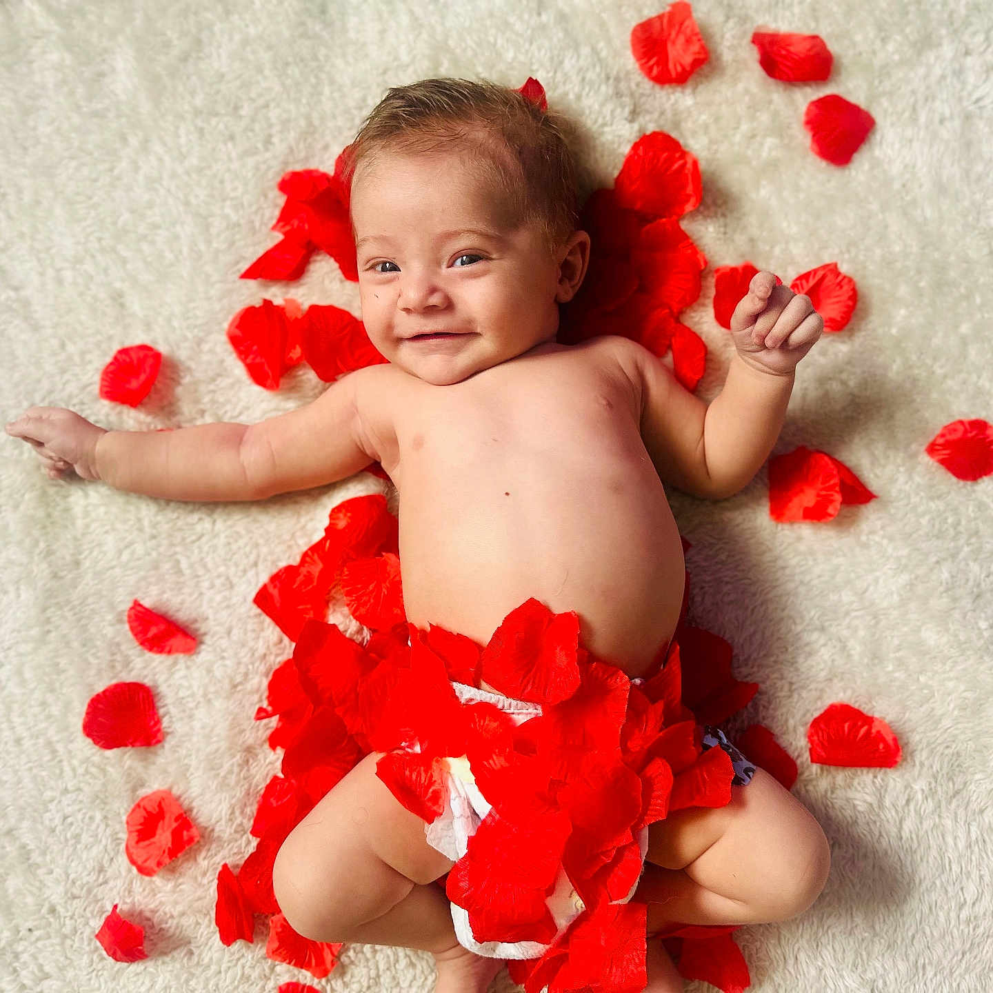 Leon is registered to the contest to win money with this photo: baby, back, bathing, bodypart, diaper, face, finger, flower, hand, happy, head, leaf, newborn, person, petal, photography, plant, portrait, smile, towel