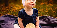 Raya joined the competition — help win amazing prizes! autumn, baby, blanket, bow, child, cute, dress, fall, happy, headband, infant, leaves, milestone, nature, outdoor, portrait, sign, sitting, smiling, wooden_sign