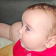 Ledger joined the competition — help win amazing prizes! baby, blanket, blue_eyes, child, closeup, curious, ear, face, focus, hair, indoor, infant, lying_down, person, portrait, profile, red_shirt, skin, soft_texture, young