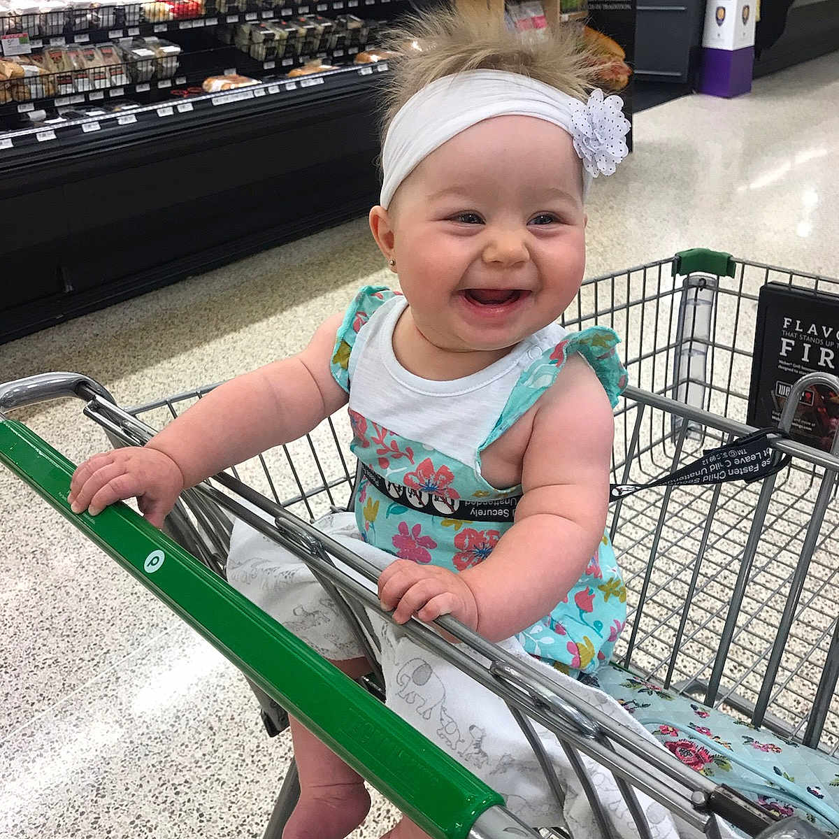 Ramona is registered to the contest to win money with this photo: baby, cart, child, fun, happy, headwear, joy, leg, people, person, product, shopping, shopping_cart, skin, smile, supermarket, toddler, tourism, vacation, vehicle