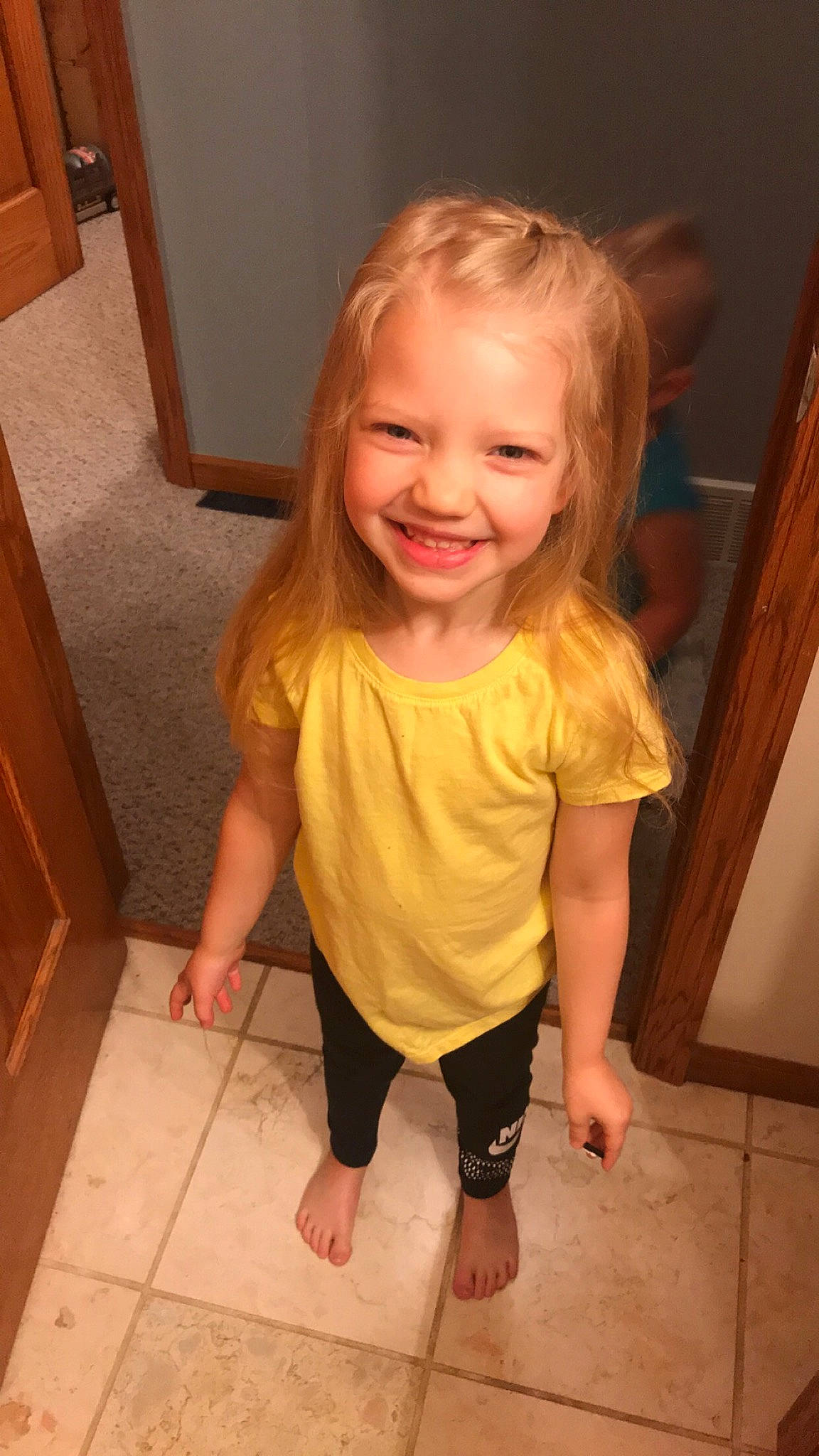Wynter joined the competition — help win amazing prizes! cheek, child, face, facial_expression, floor, flooring, head, joy, leg, mouth, neck, person, shoulder, skin, sleeve, smile, standing, toddler, tooth