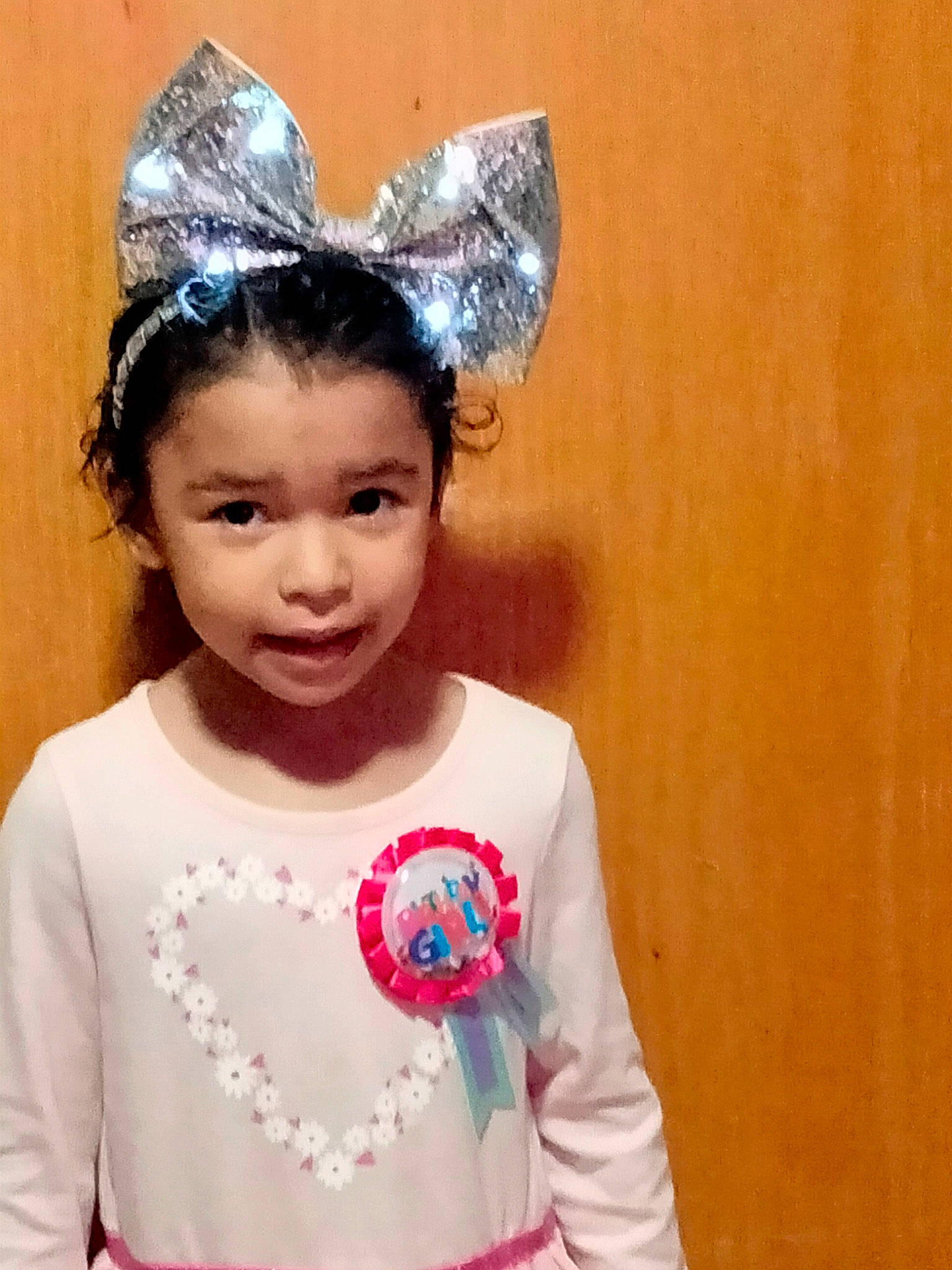 Ripley joined the competition — help win amazing prizes! baby_toddler_clothing, child, chin, clothing, costume, costume_hat, dress, embellishment, eyebrow, eyelash, fashion_accessory, happy, head, headband, headpiece, jewellery, neck, person, pink, sleeve