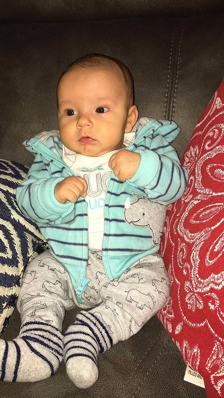 Braxten is registered to the contest to win money with this photo: boy, cheek, child, cool, eye, fun, girl, head, human, infant, iris, person, product, sitting, skin, smile, textile, toddler