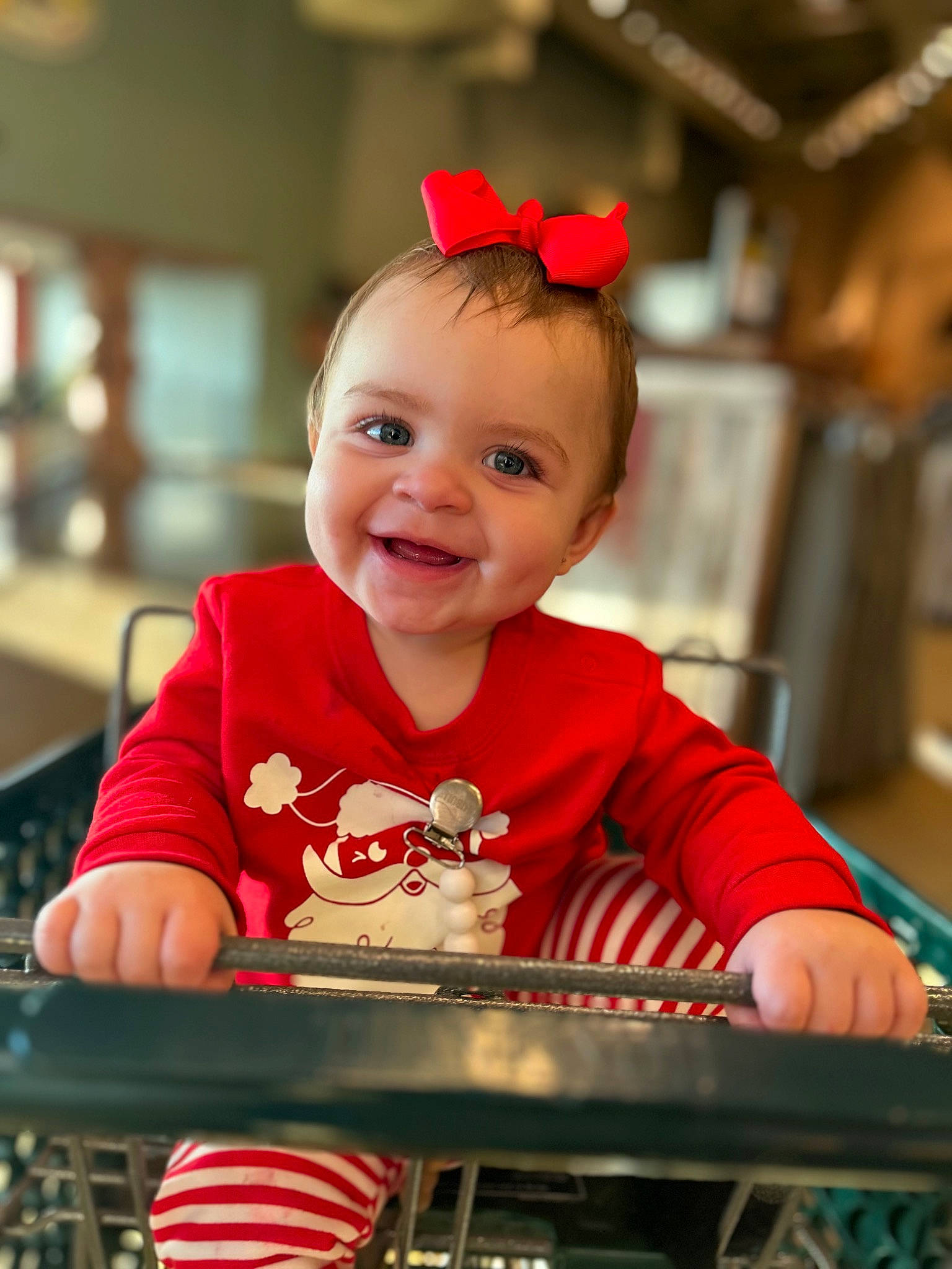 Layana joined the competition — help win amazing prizes! baby, baby_toddler_clothing, child, event, facial_expression, fun, happy, holiday, joy, leisure, magenta, motor_vehicle, person, recreation, red, shopping_cart, sitting, sleeve, smile, t_shirt
