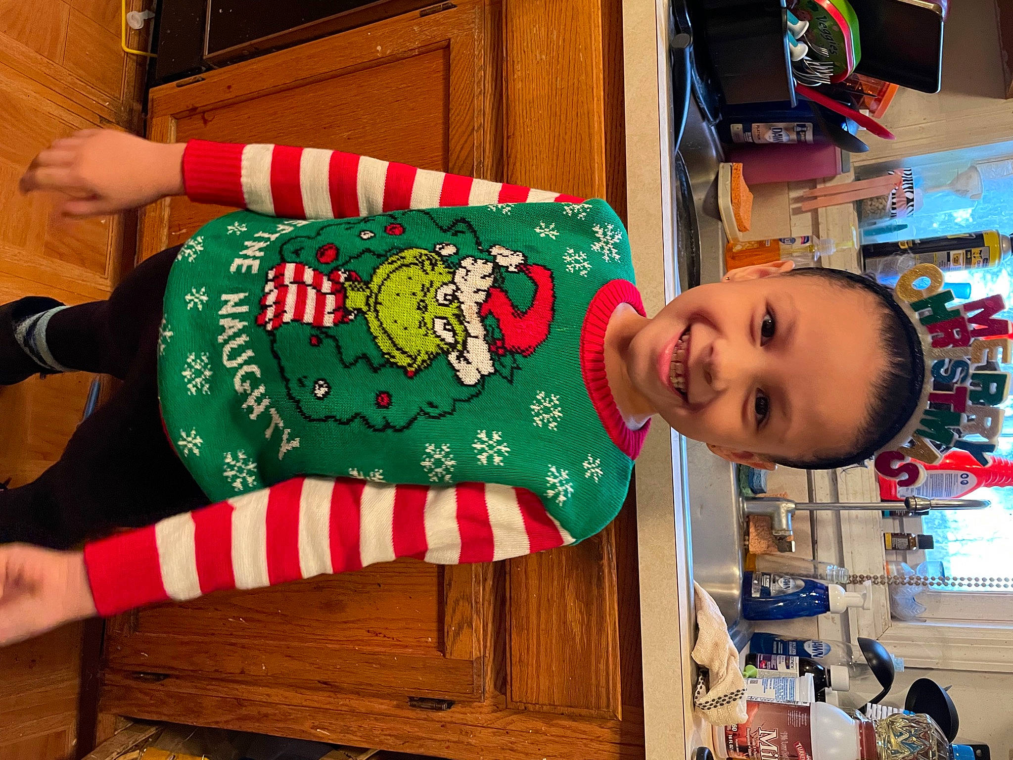 Jaylynn joined the competition — help win amazing prizes! carmine, child, christmas, christmas_decoration, christmas_eve, christmas_stocking, event, happy, holiday, joy, pattern, person, photograph, play, red, room, sleeve, smile, standing, t_shirt