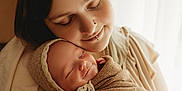 Willow is registered to the contest to win money with this photo: adult, baby, blanket, bodypart, clothing, face, female, finger, hand, happy, head, newborn, person, photography, portrait, skin, sleeping, smile, tattoo, woman