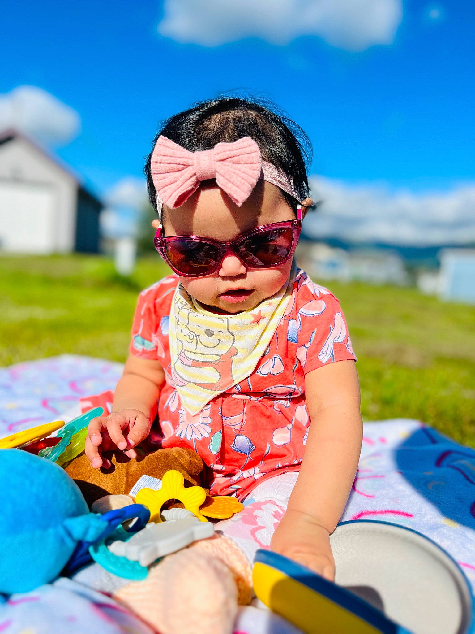 Danica is registered to the contest to win money with this photo: baby, baby_toddler_clothing, blue, child, cloud, event, eyewear, fun, goggles, grass, happy, headwear, leisure, people_in_nature, person, personal_protective_equipment, recreation, shorts, sky, sunglasses