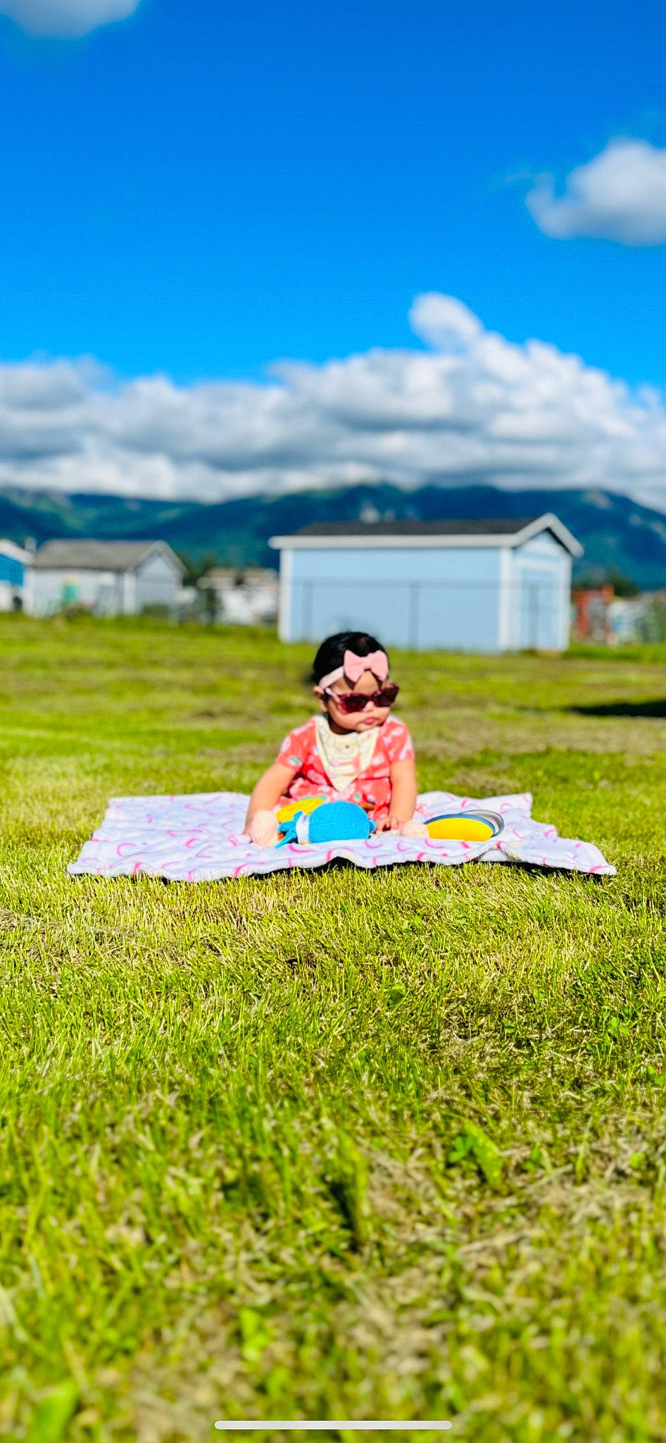 Danica joined the competition — help win amazing prizes! body_of_water, cloud, eyewear, fun, grass, grass_family, grassland, happy, horizon, landscape, lawn, leisure, meadow, people_in_nature, person, plant, recreation, shorts, sky, sunglasses