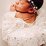 Kaliyah is registered to the contest to win money with this photo: newborn, baby, sleeping, lace, white, gold_stars, headband, pearl, soft_lighting, portrait, infant, cute, peaceful, closeup, delicate, fabric, skin, tiny, resting, adorable