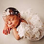 Kaliyah joined the competition — help win amazing prizes! newborn, baby, sleeping, infant, headband, butterfly, white_dress, frills, gold_stars, soft_background, peaceful, portrait, closeup, cute, tiny_hands, delicate, resting, child, adorable, soft_lighting