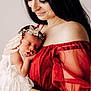 newborn, baby, woman, mother, holding, sleeping, dress, red_dress, headband, butterfly, portrait, love, tenderness, skin, face, hand, indoor, soft_light, closeup, family