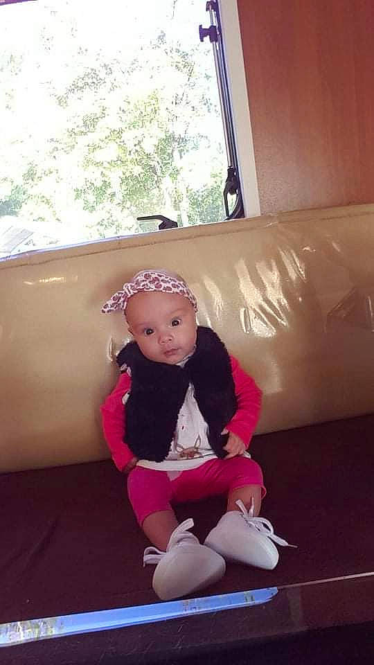 Elynn participe au concours pour gagner de l'argent avec cette photo : baby_toddler_clothing, child, comfort, couch, floor, flooring, fun, goggles, headwear, human_leg, knee, leisure, magenta, outdoor_play_equipment, person, personal_protective_equipment, sitting, sock, t_shirt, thigh