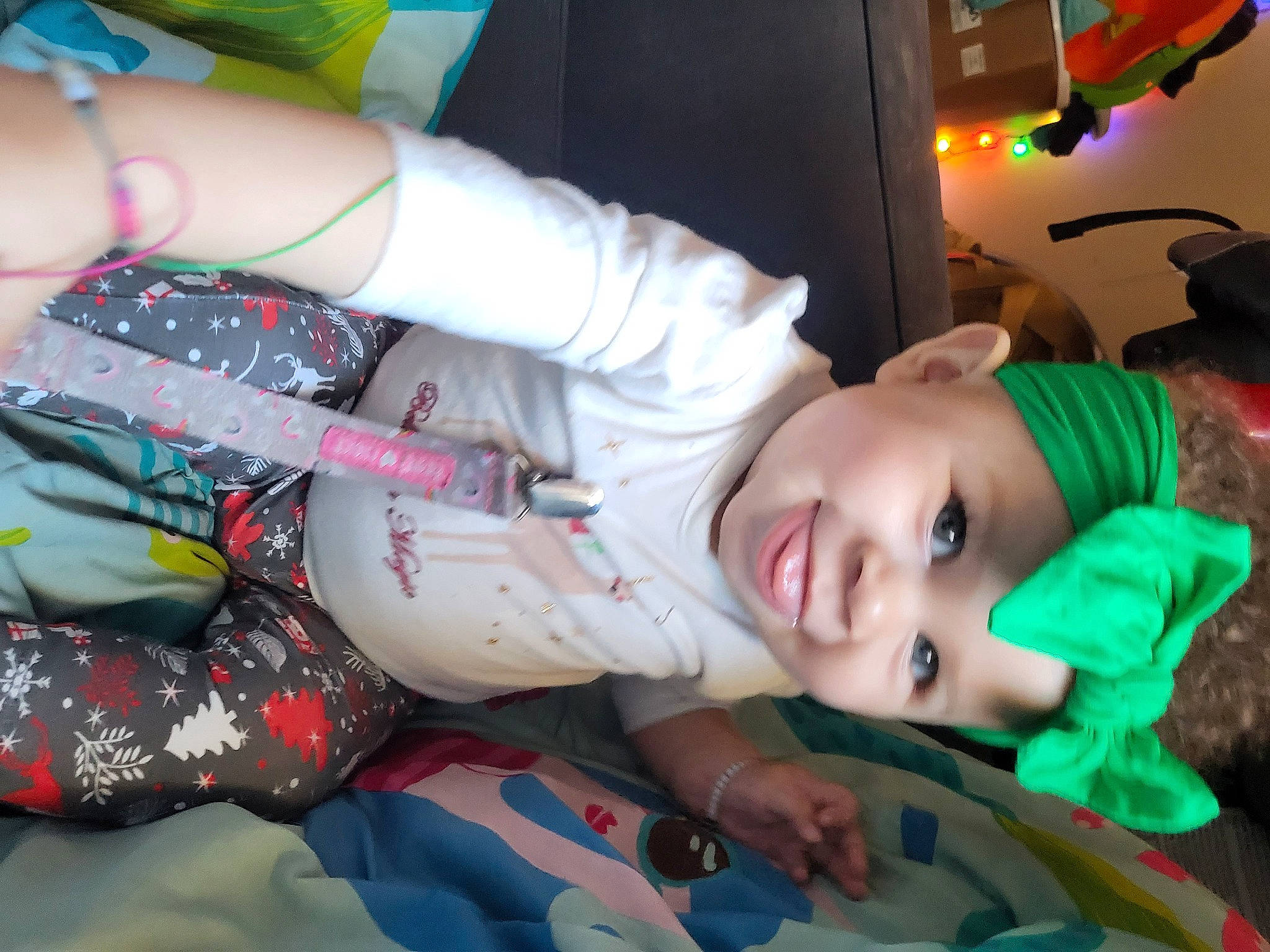 Izzy is registered to the contest to win money with this photo: child, cool, event, fictional_character, flesh, fun, hat, headwear, human_body, human_leg, joy, mouth, nail, pattern, person, plant, room, smile, sun_hat, thigh