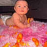 Luka joined the competition — help win amazing prizes! baby, cheeky, cheese_puff, child, crawling, cute, diaper, face, floor, fluffy_rug, food, hand, indoor, lying_down, mess, pink_rug, skin, smiling, snack, toy